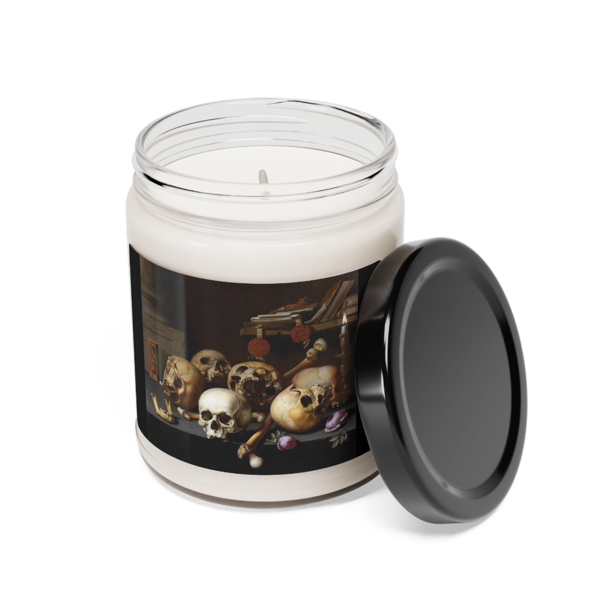 a candle with a picture of skulls on it