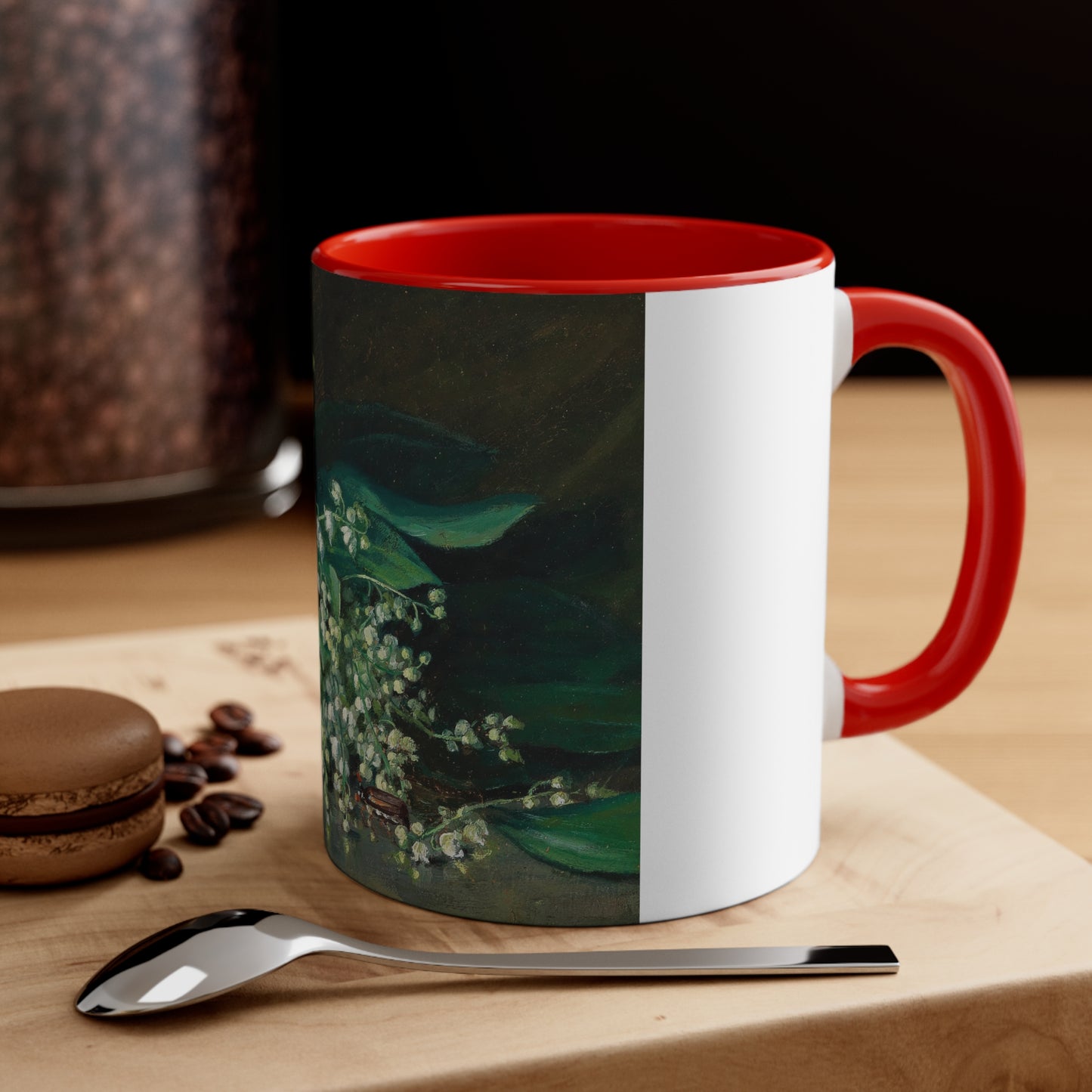 a red and white coffee mug sitting on top of a wooden table