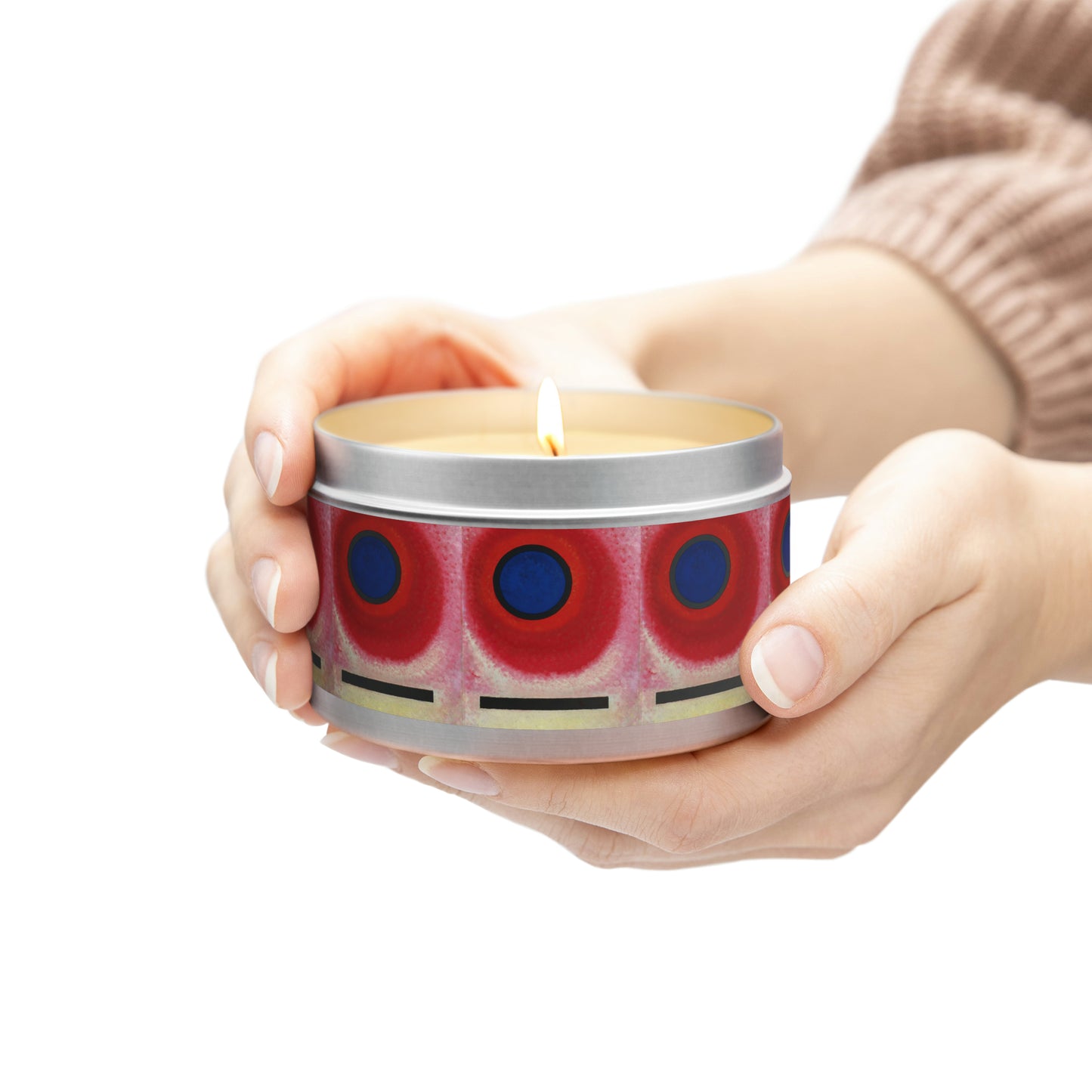 a person holding a candle in a tin