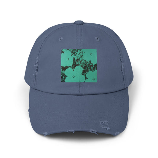 a blue hat with a green flower on it