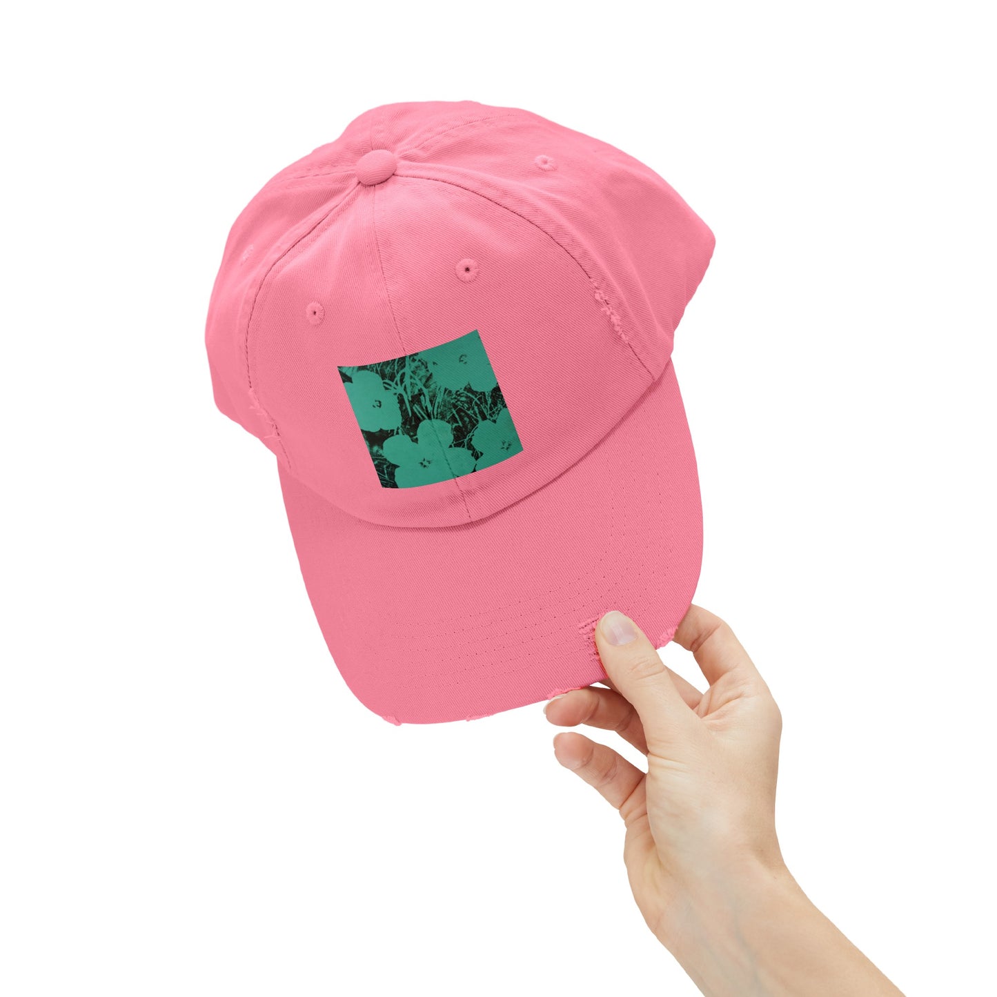 a person holding a pink hat with a picture on it