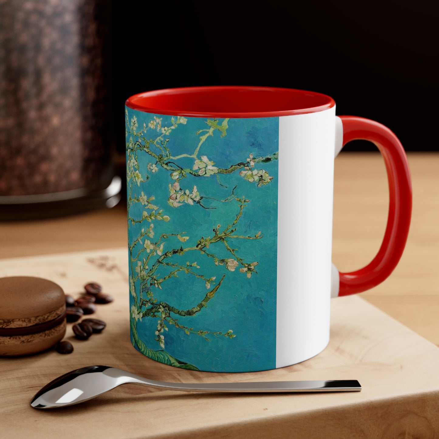 a red and white coffee mug sitting on top of a wooden table