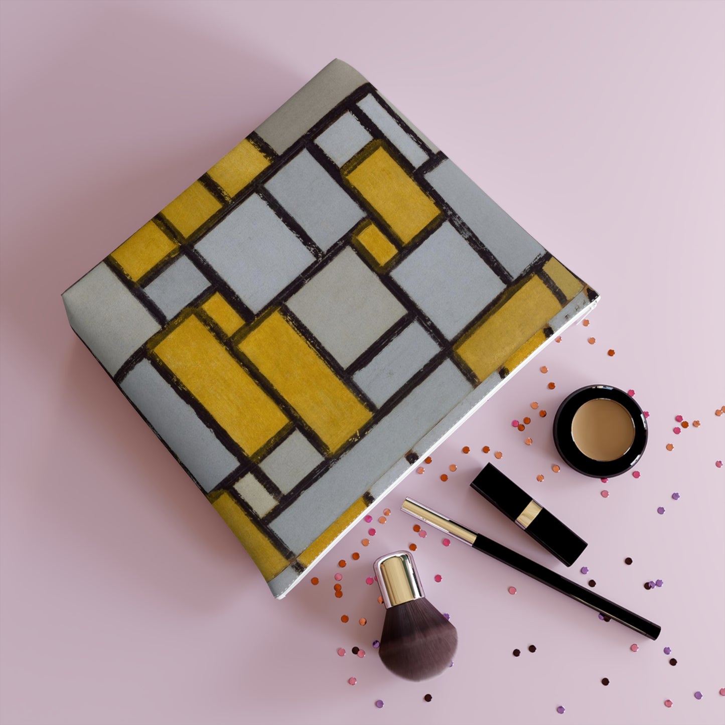 a table topped with makeup and a bottle of liquid