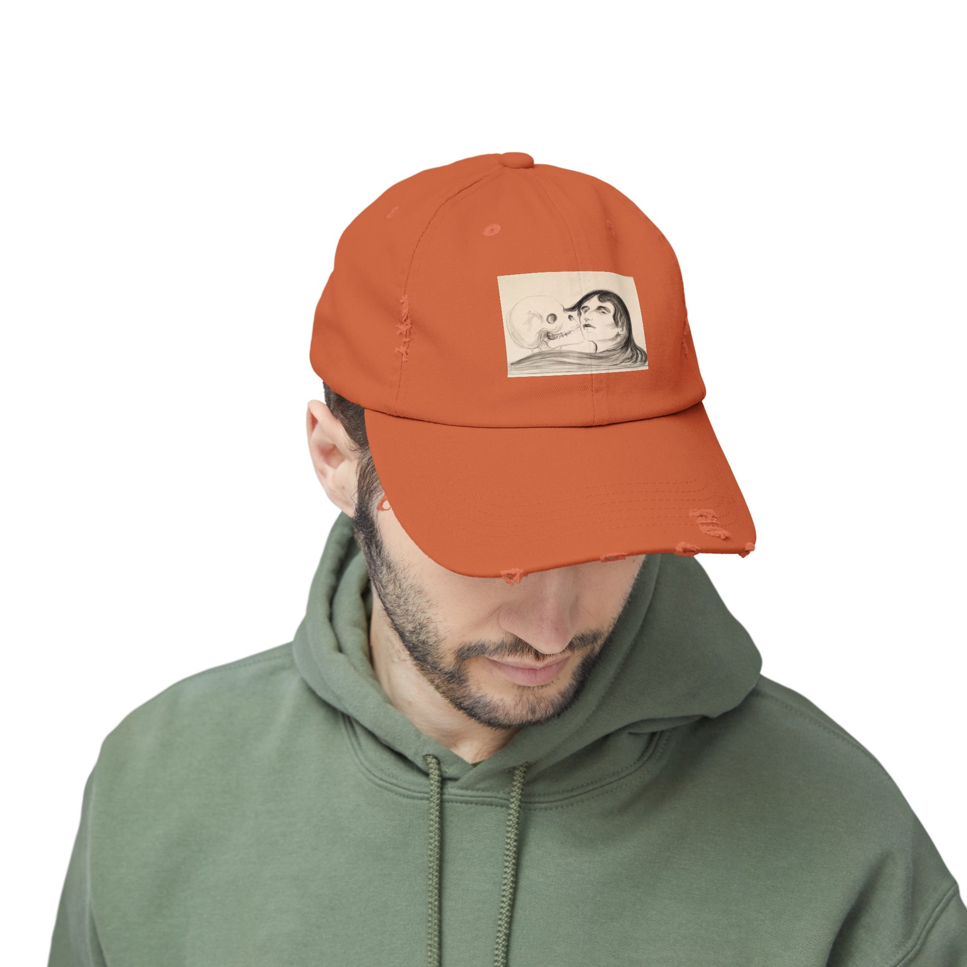 a man wearing an orange hat with a picture of a man on it