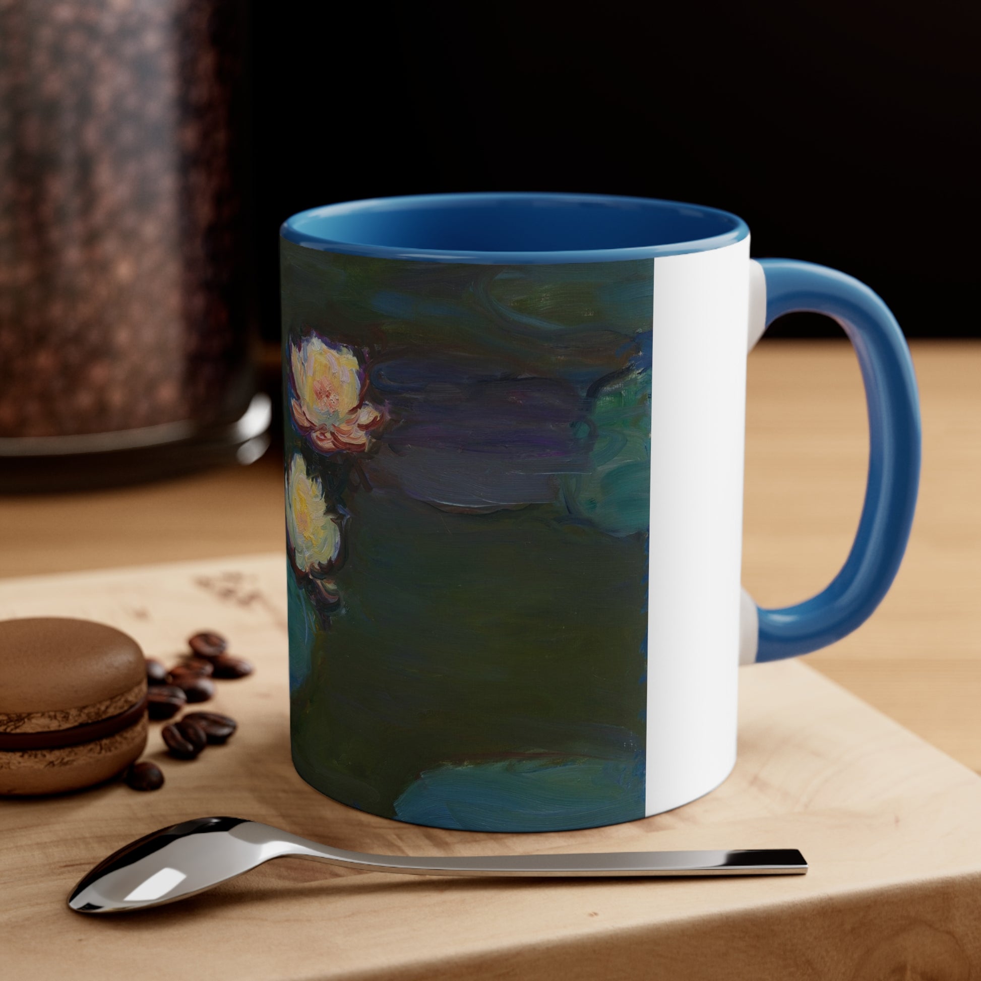 a blue and white coffee mug sitting on top of a wooden table