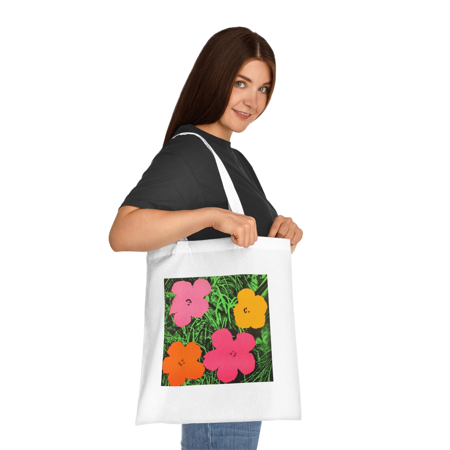 a woman holding a bag with flowers on it