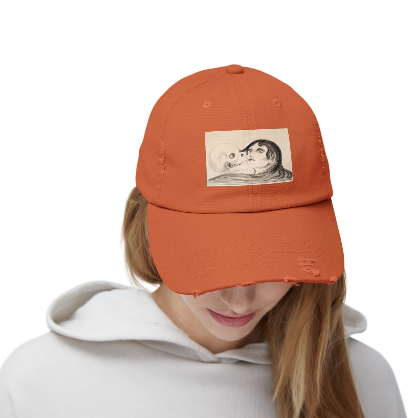 a woman wearing an orange hat with a picture of a man on it