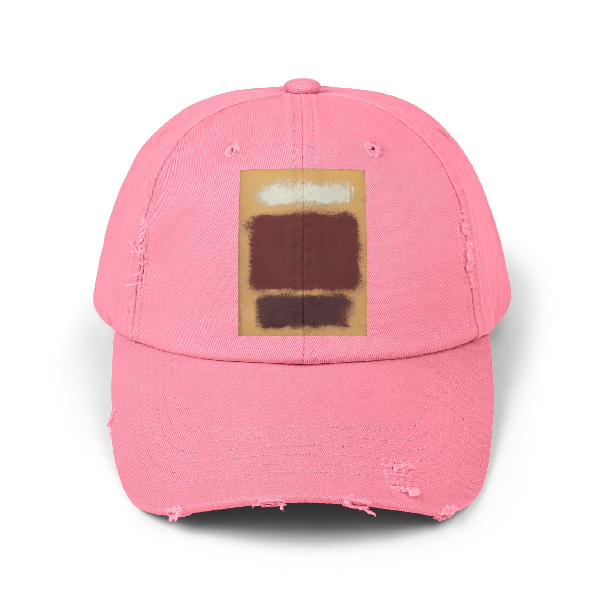 a pink hat with a brown square on it