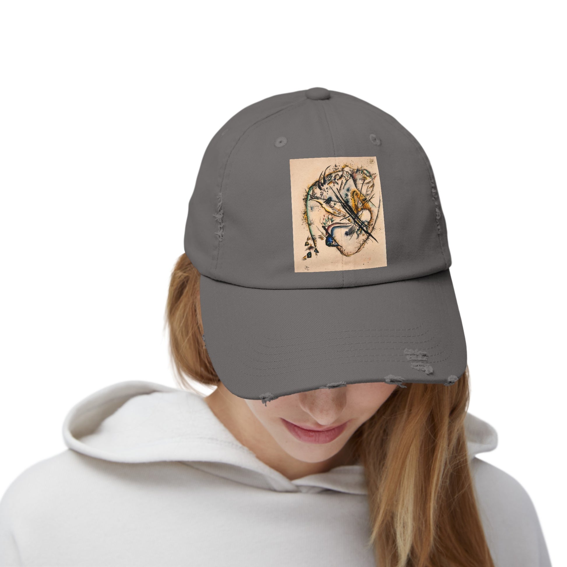 a woman wearing a gray hat with a picture of a tiger on it