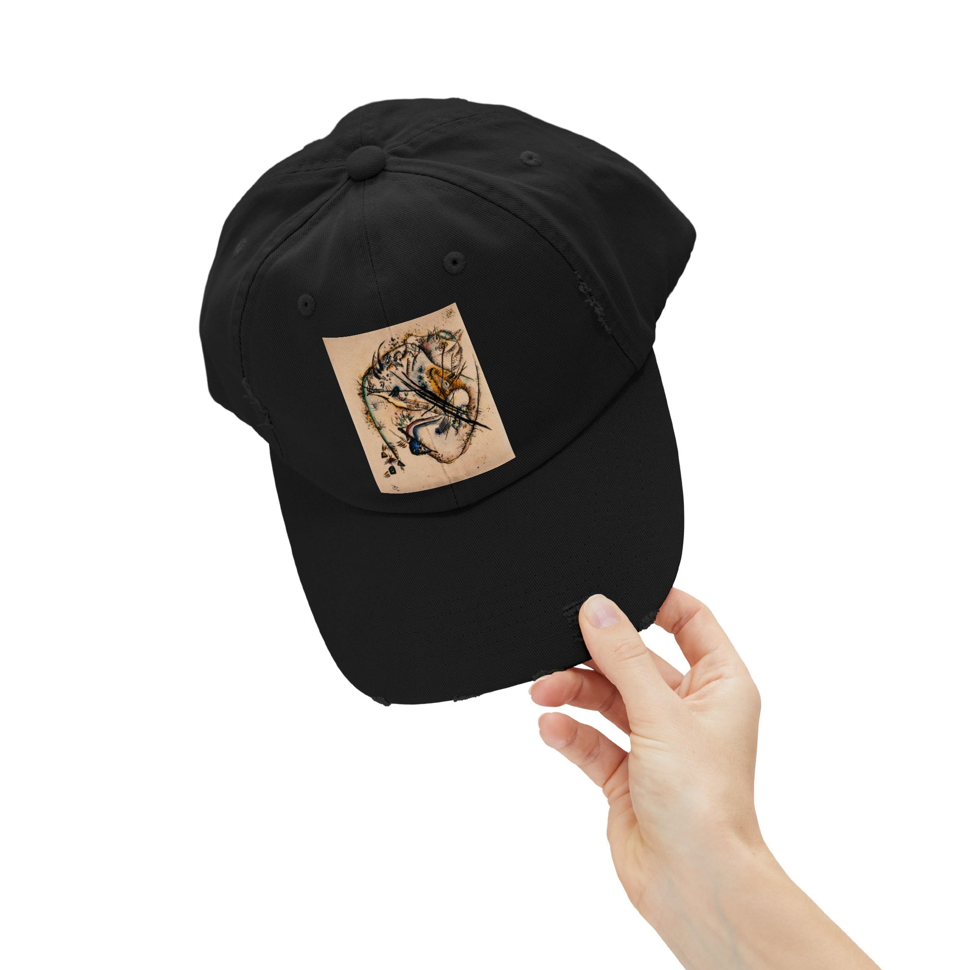 a person holding a black hat with a dragon on it