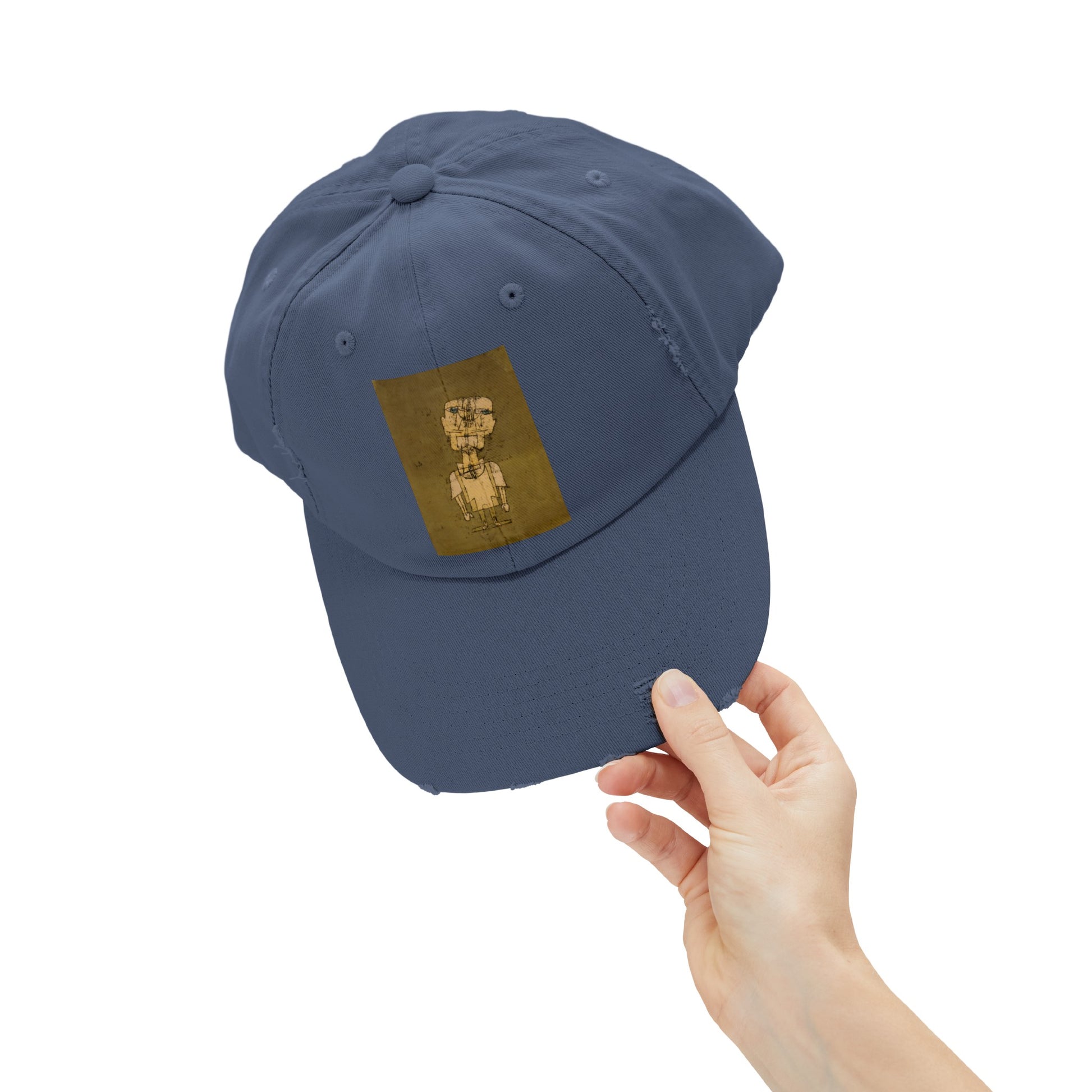 a person holding a baseball cap with a picture of a dog on it