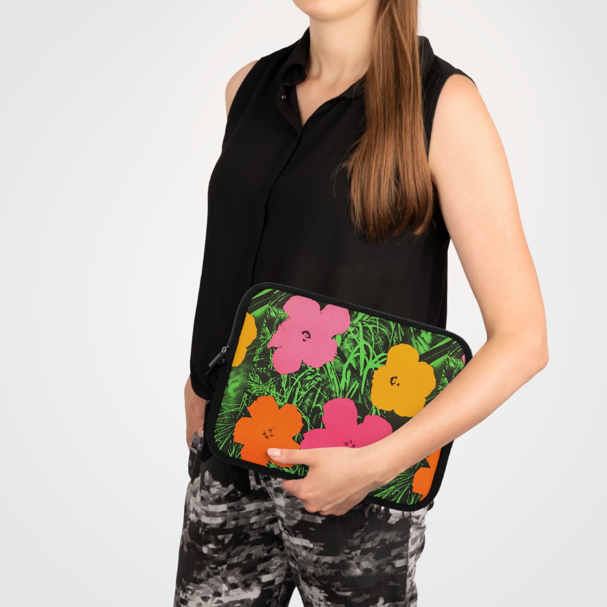 a woman in black shirt holding a flowered purse