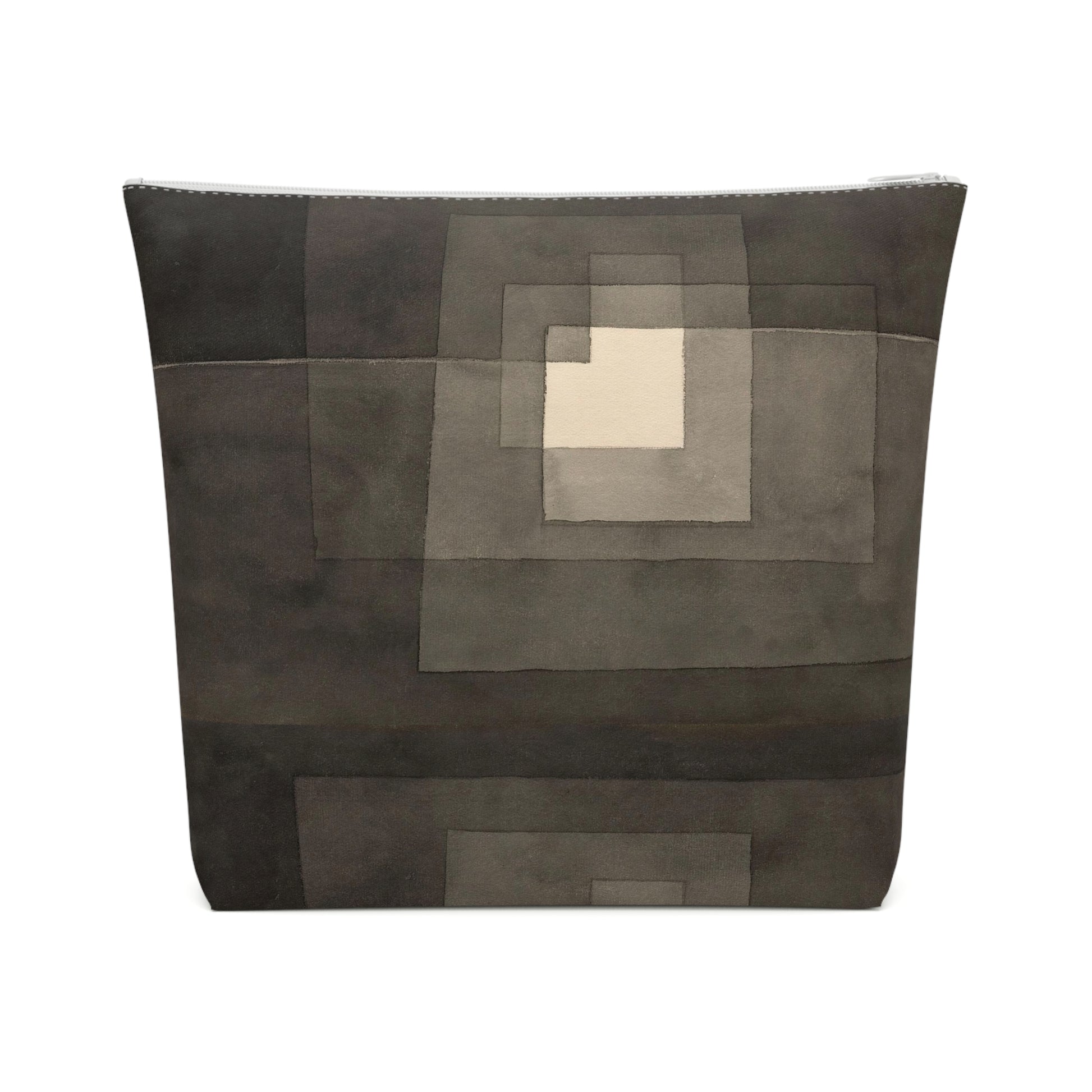 a black and grey bag with a square in the middle