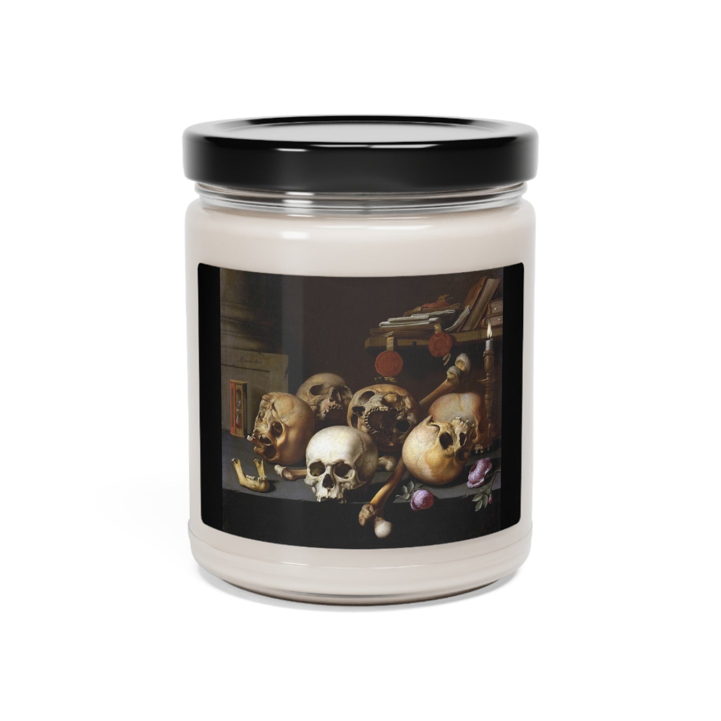 a candle with a picture of skulls on it