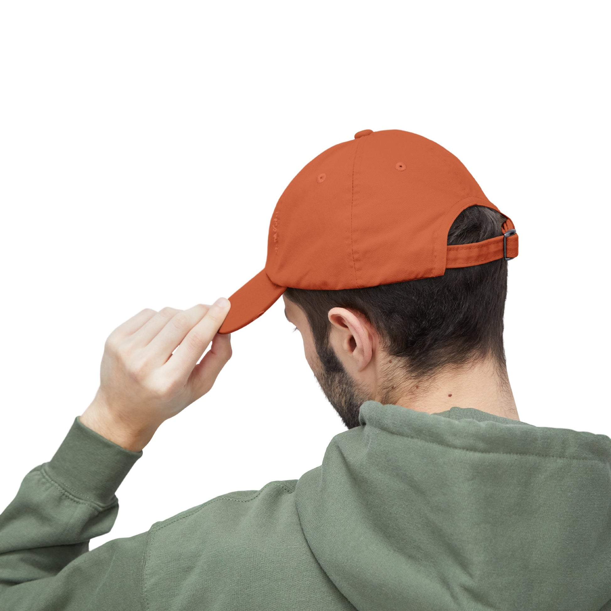 a man wearing an orange hat and a green sweatshirt