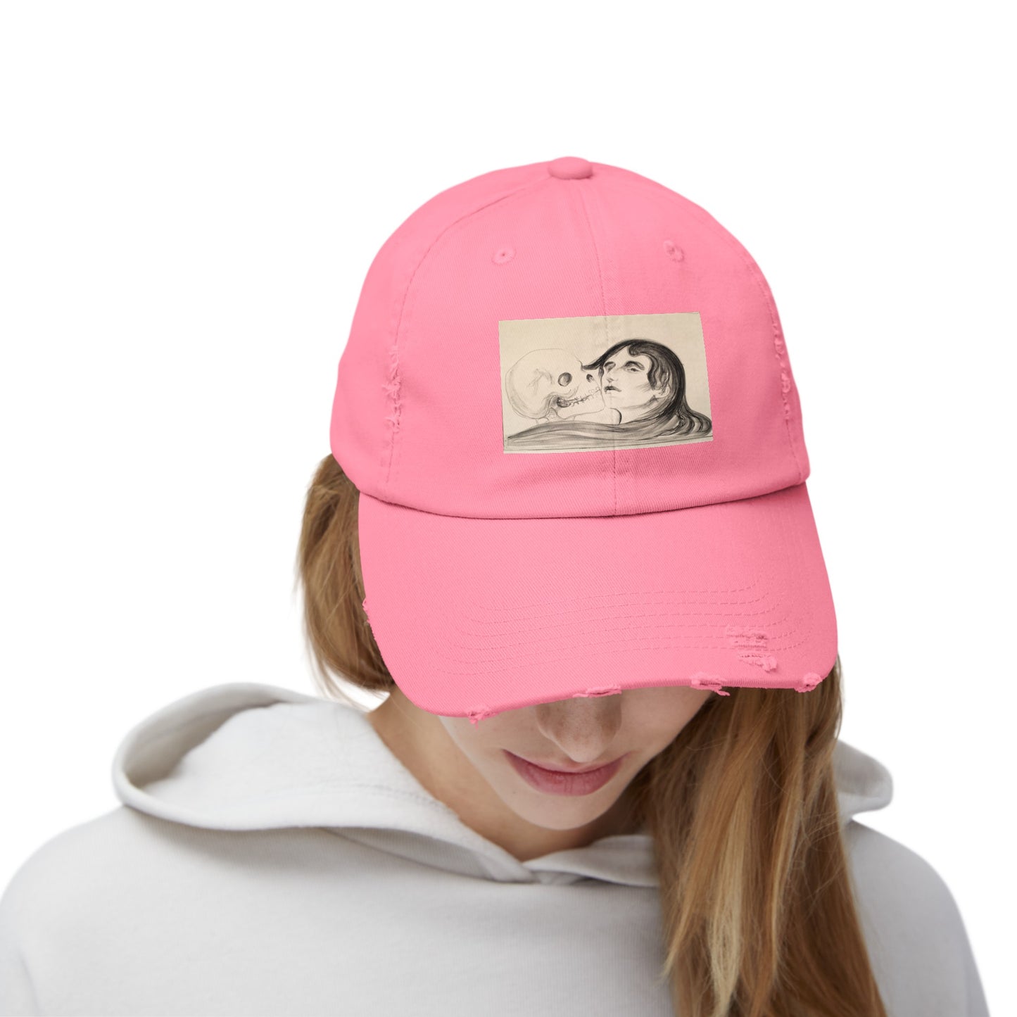 a woman wearing a pink hat with a picture of a man and woman on it