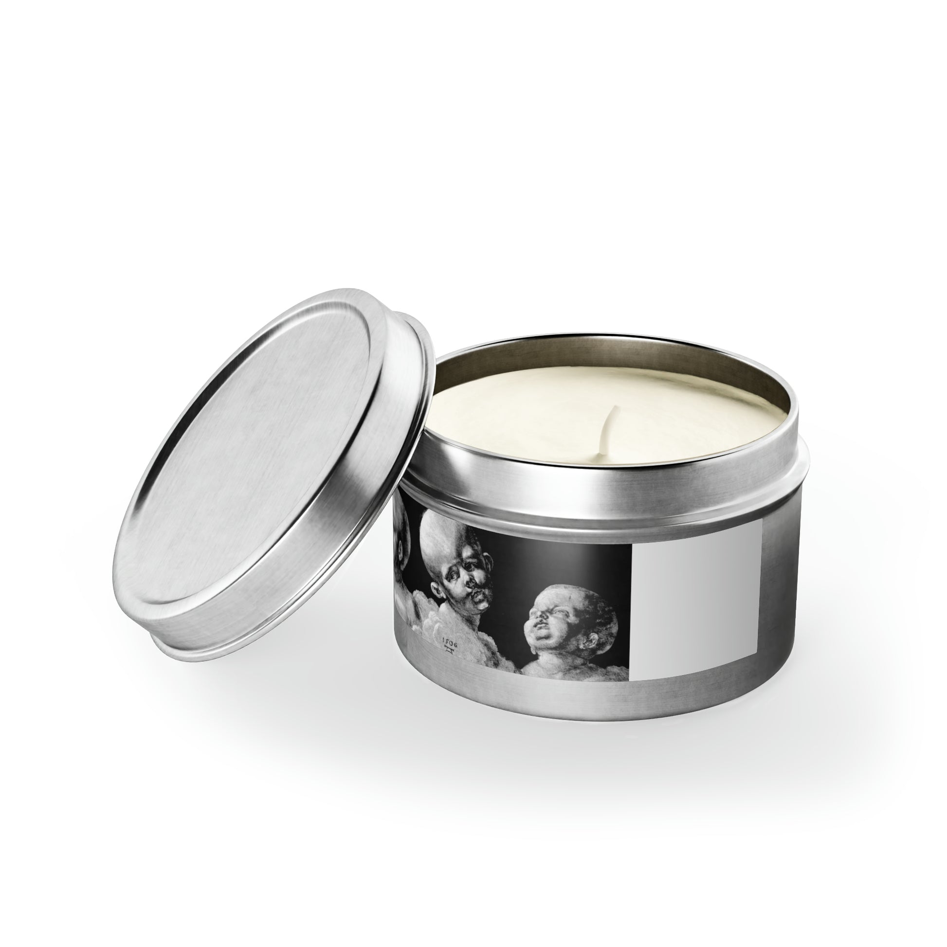 a candle in a tin with a picture on it
