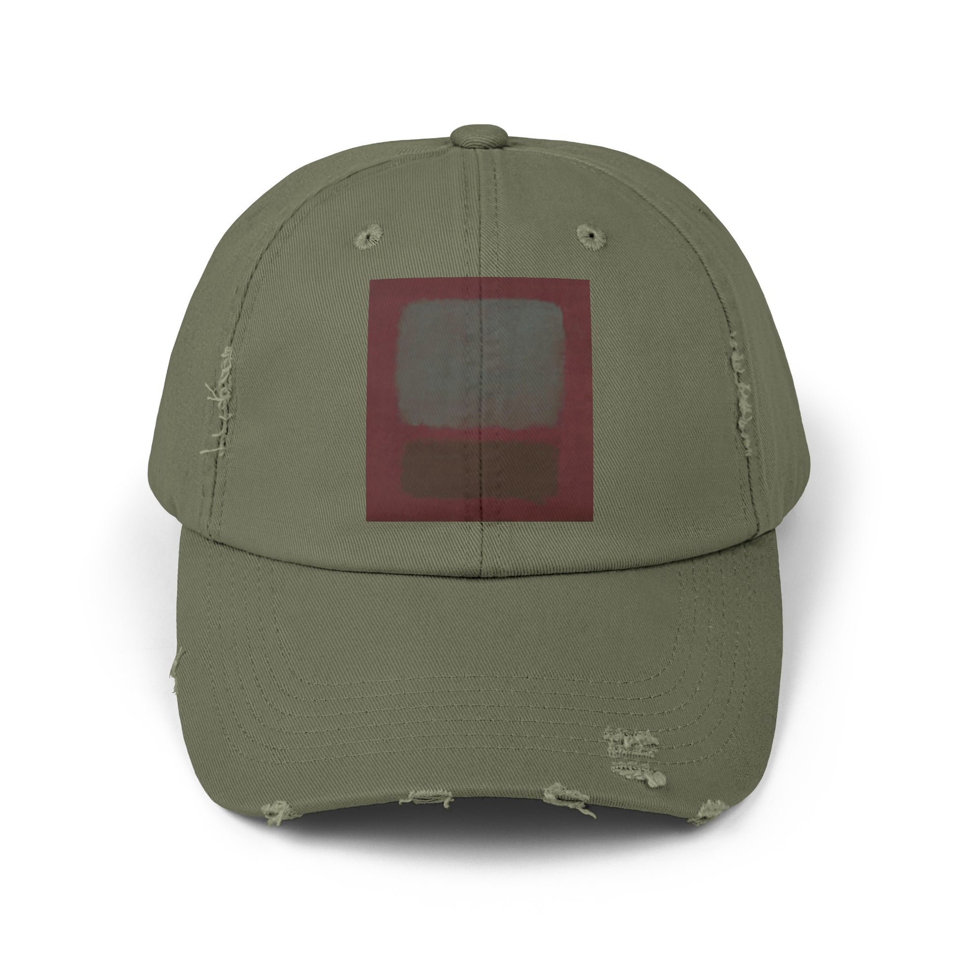 a green hat with a red square on it