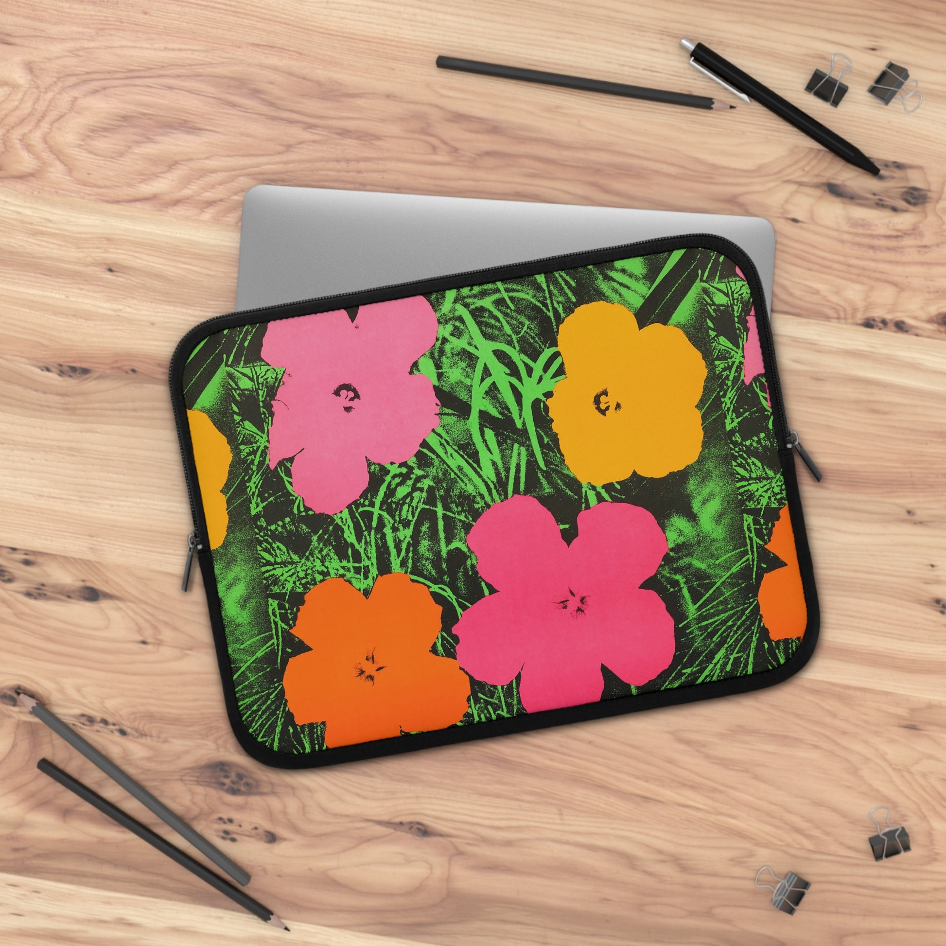 a laptop computer case with flowers on it