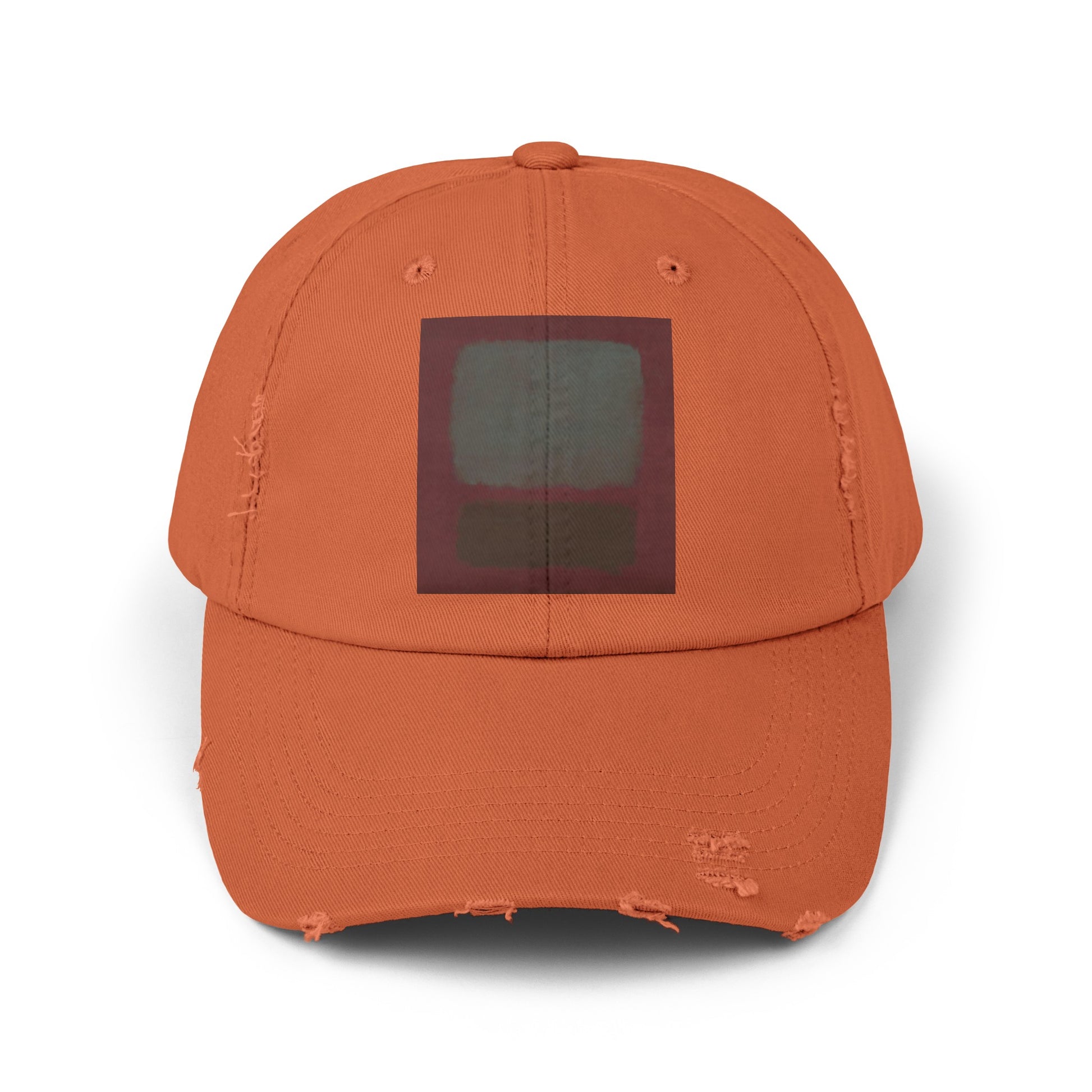 an orange baseball cap with a black square on it