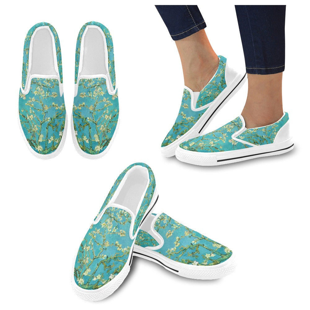 a pair of women's slip - ons with blue flowers