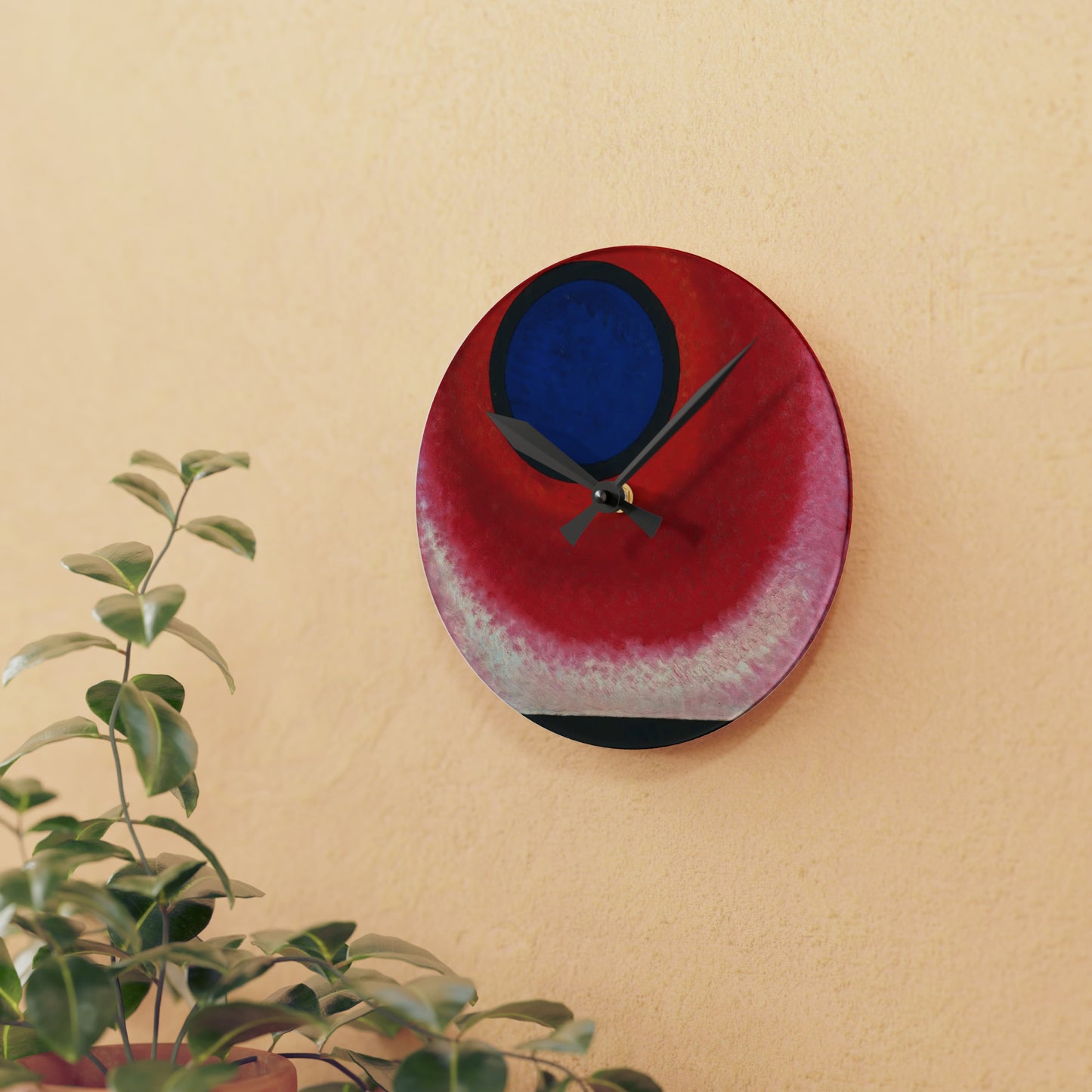 a red and blue clock on a wall next to a potted plant