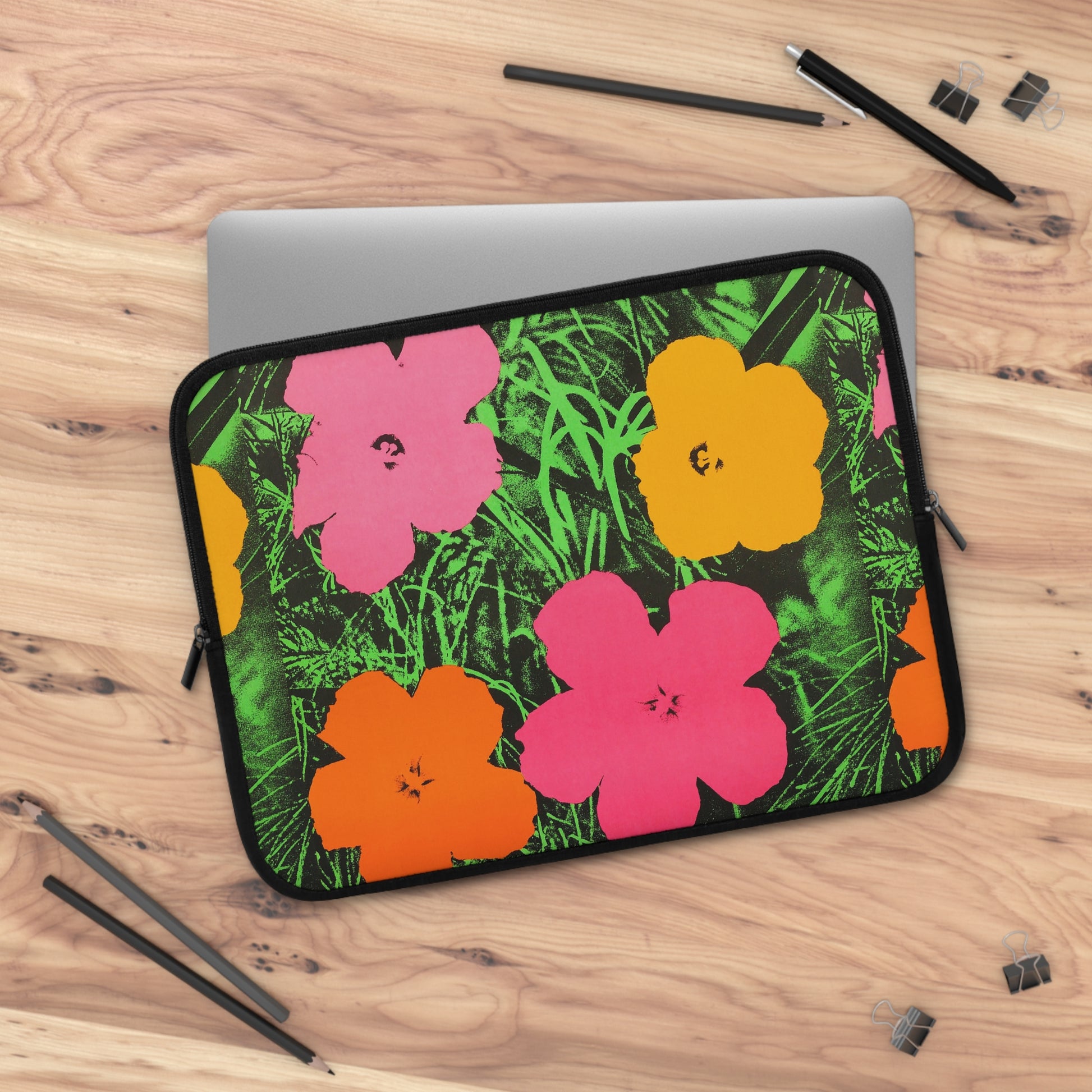 a laptop computer case with flowers on it