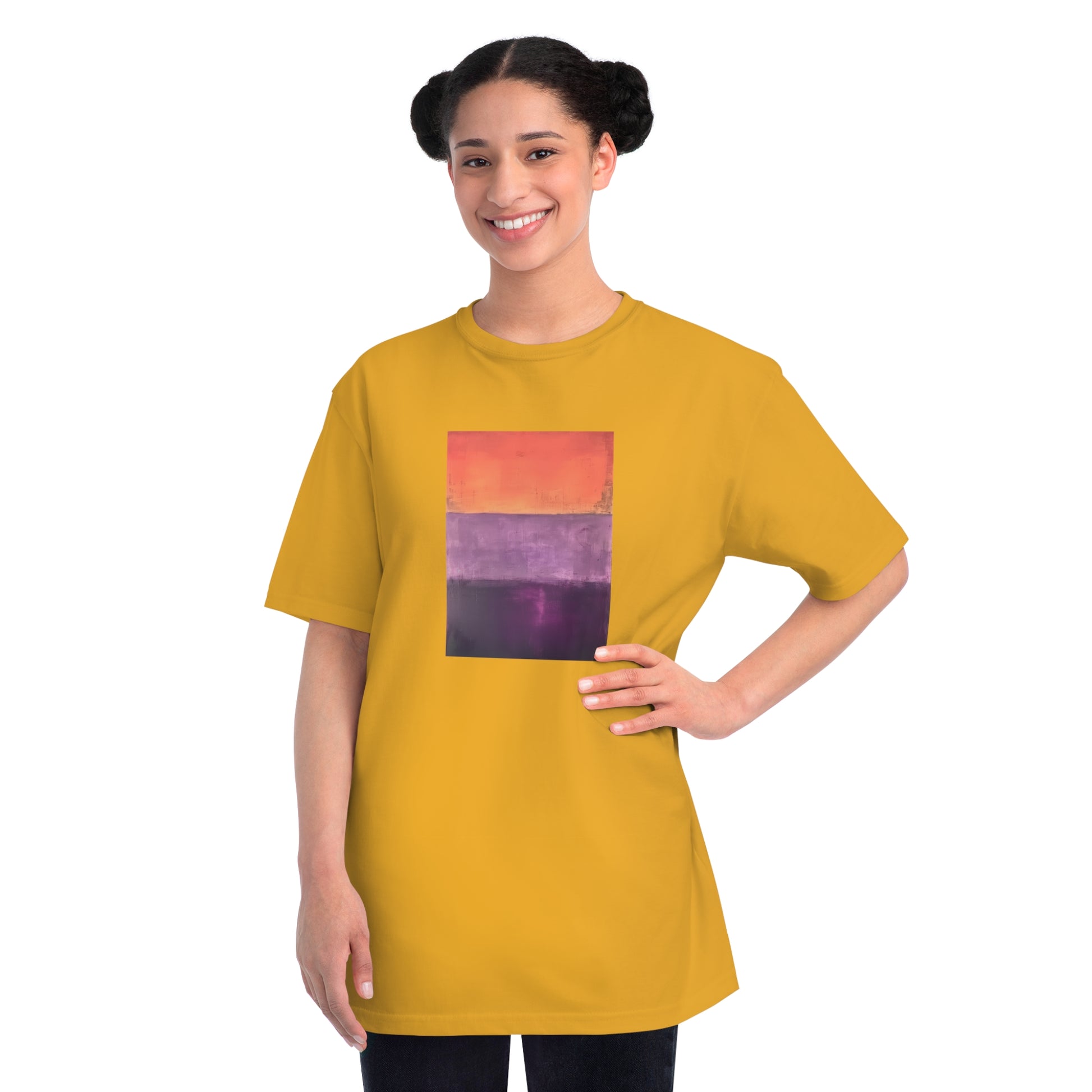 a woman wearing a yellow t - shirt with a picture of a sunset