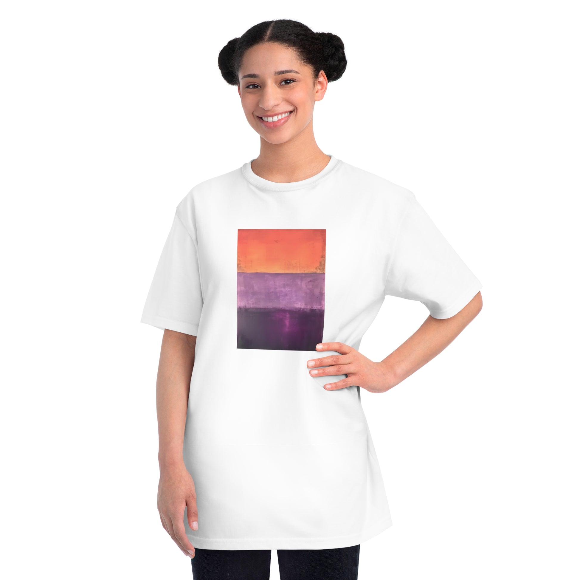 a woman wearing a white t - shirt with a picture of a sunset