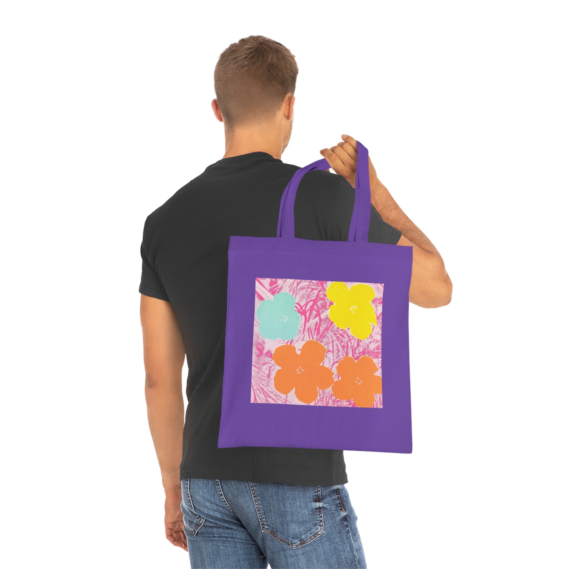 a man is holding a purple bag with flowers on it