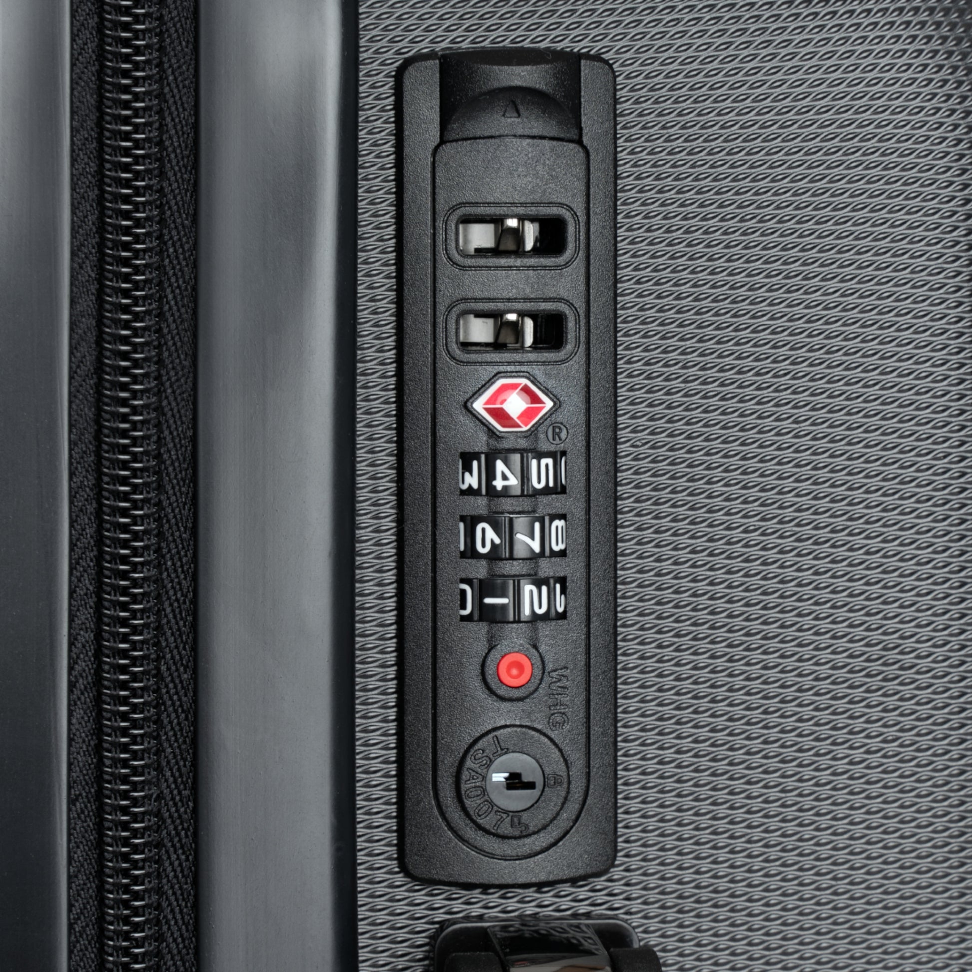 a close up of a remote control on a piece of luggage