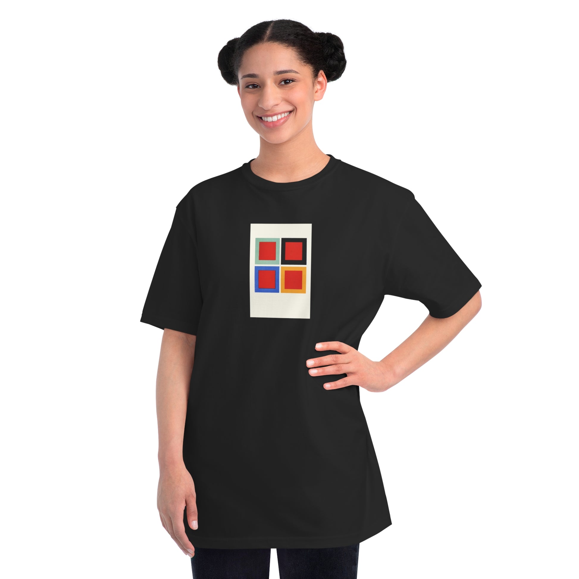 a woman wearing a black t - shirt with a colorful square on it