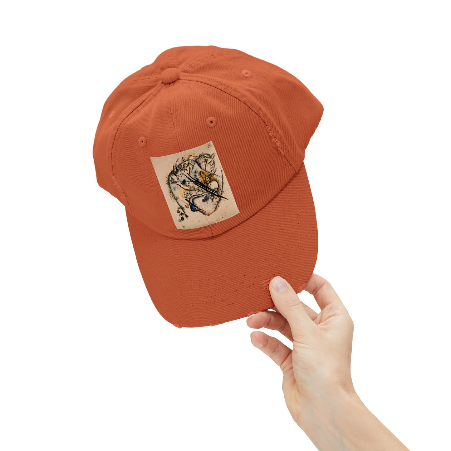 a person holding a baseball cap with a sticker on it