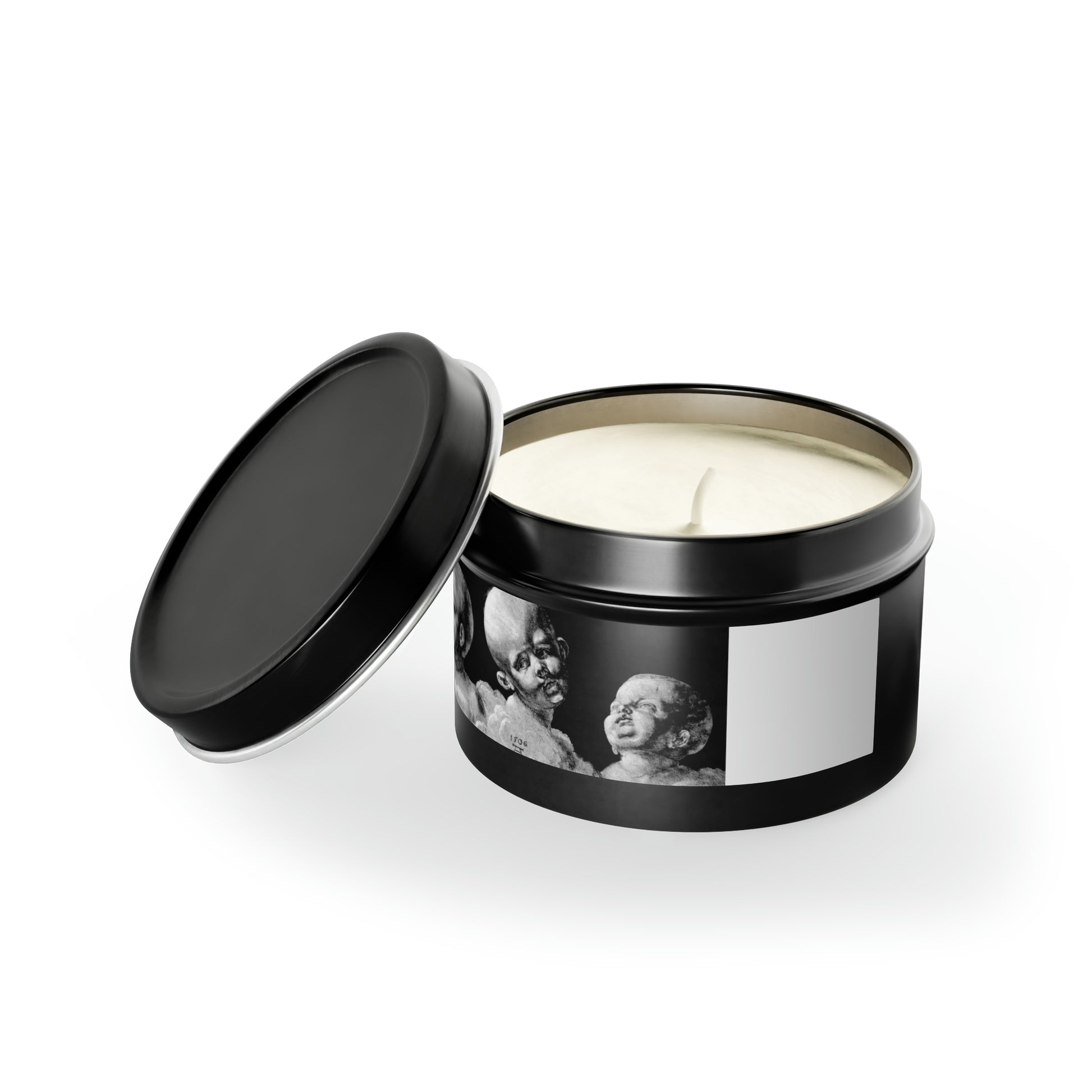 a black tin with a white candle inside of it