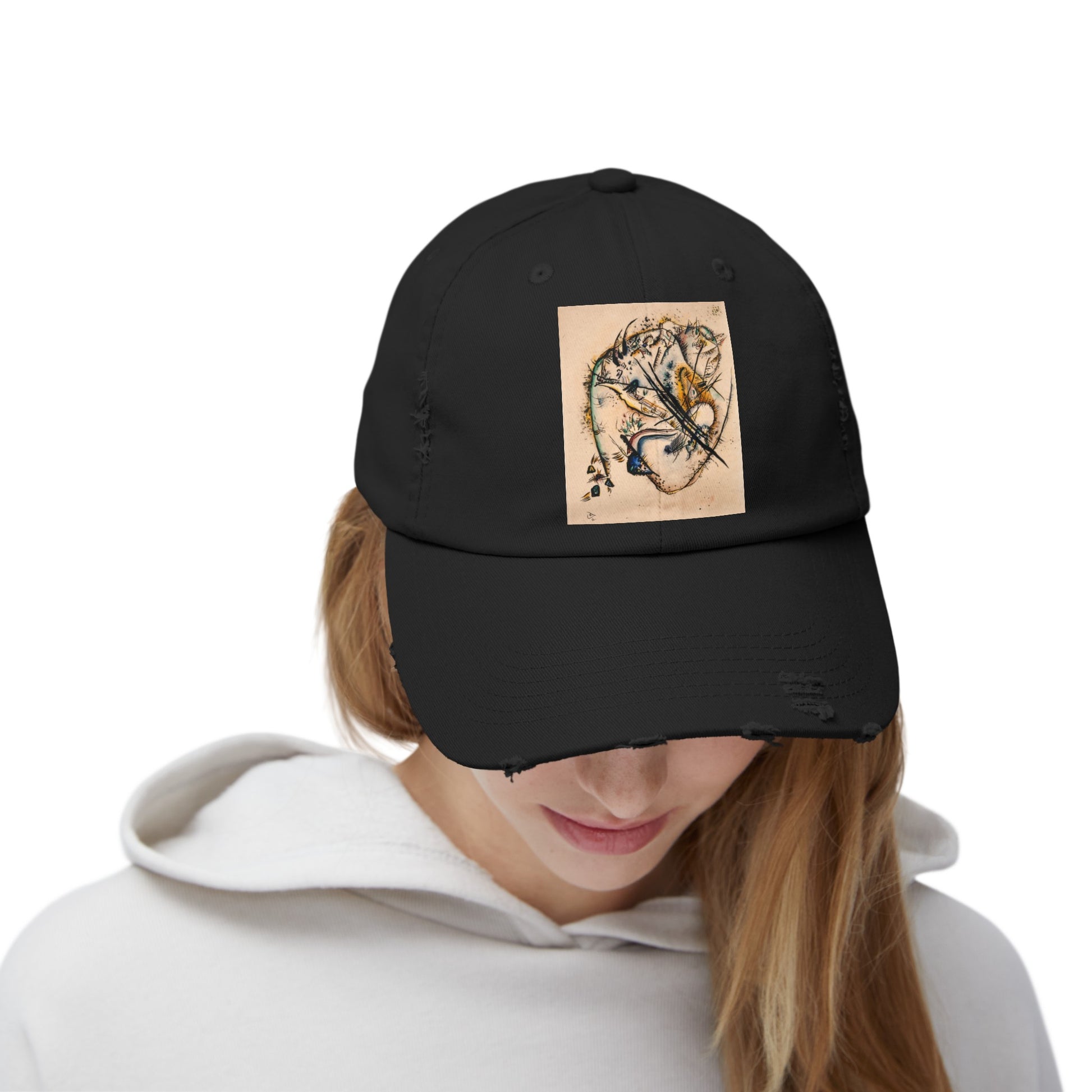 a woman wearing a black hat with a picture of a tiger on it