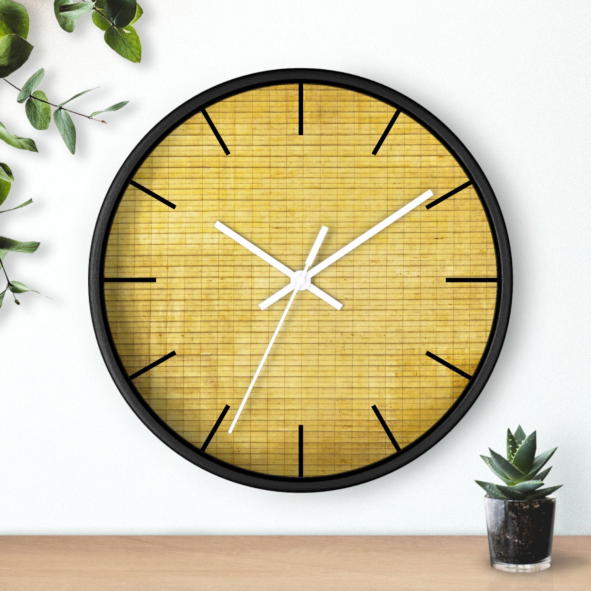 a clock on a wall next to a potted plant
