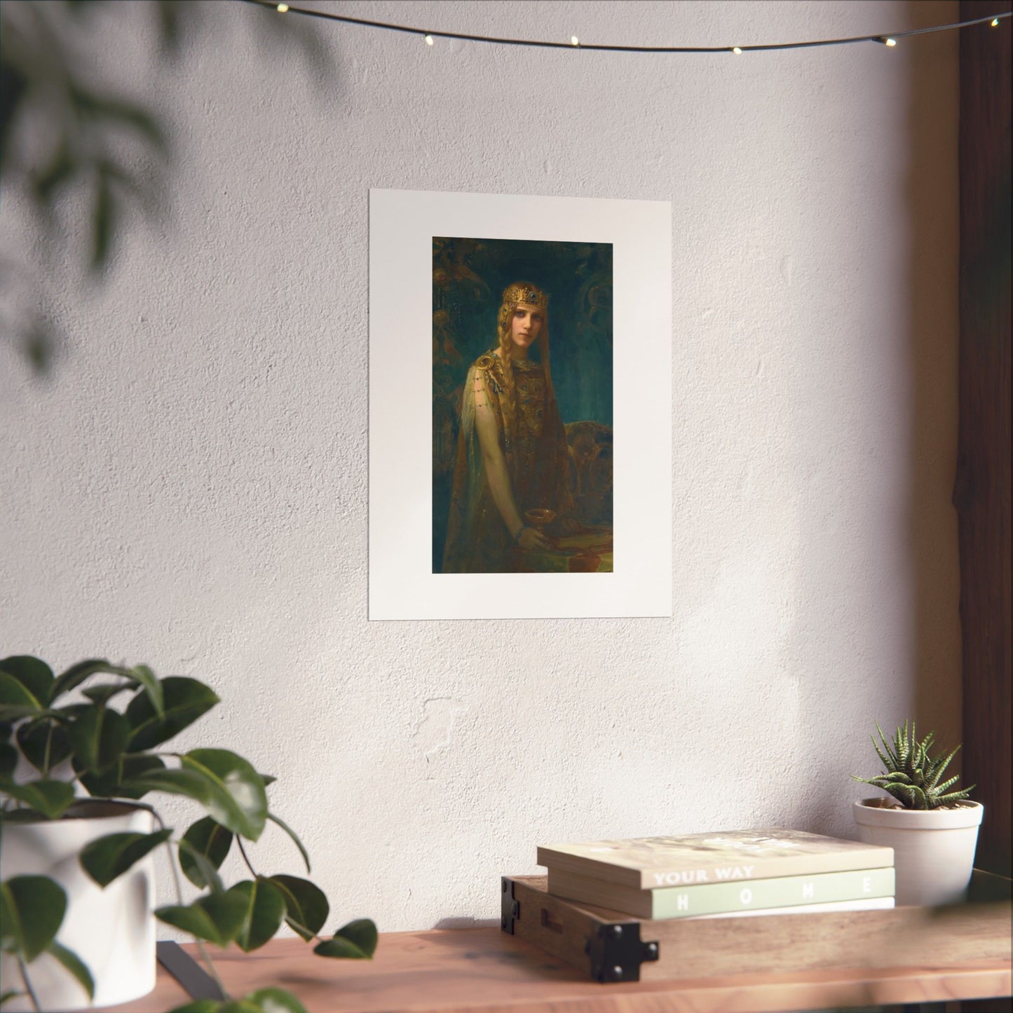 a picture of a woman is hanging on a wall