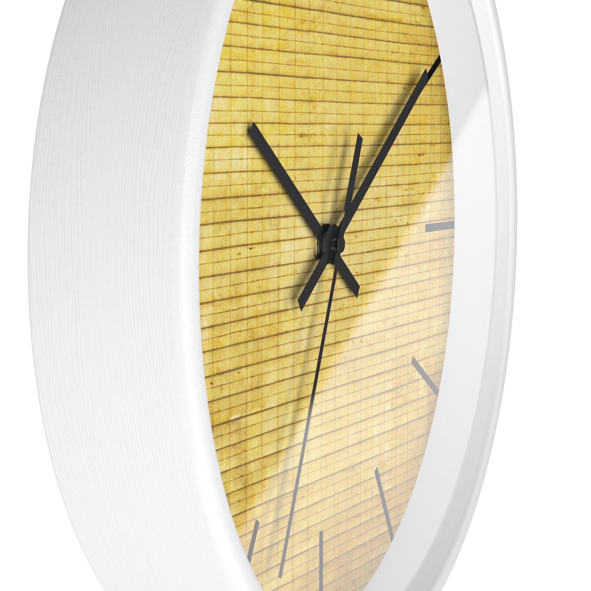 a close up of a clock on a white wall