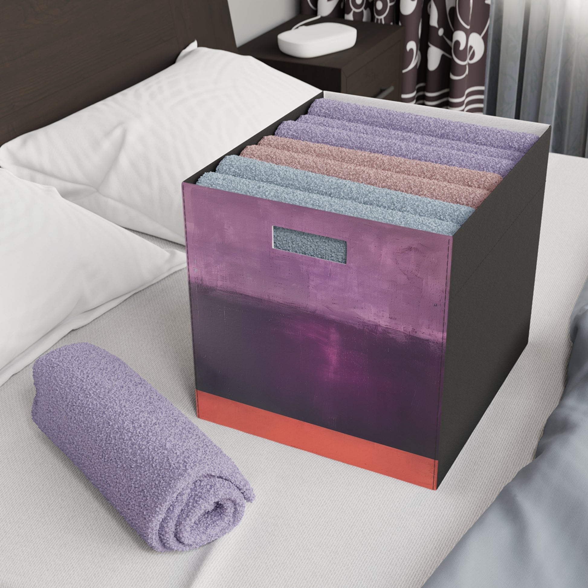 a bed with a purple and black box on top of it