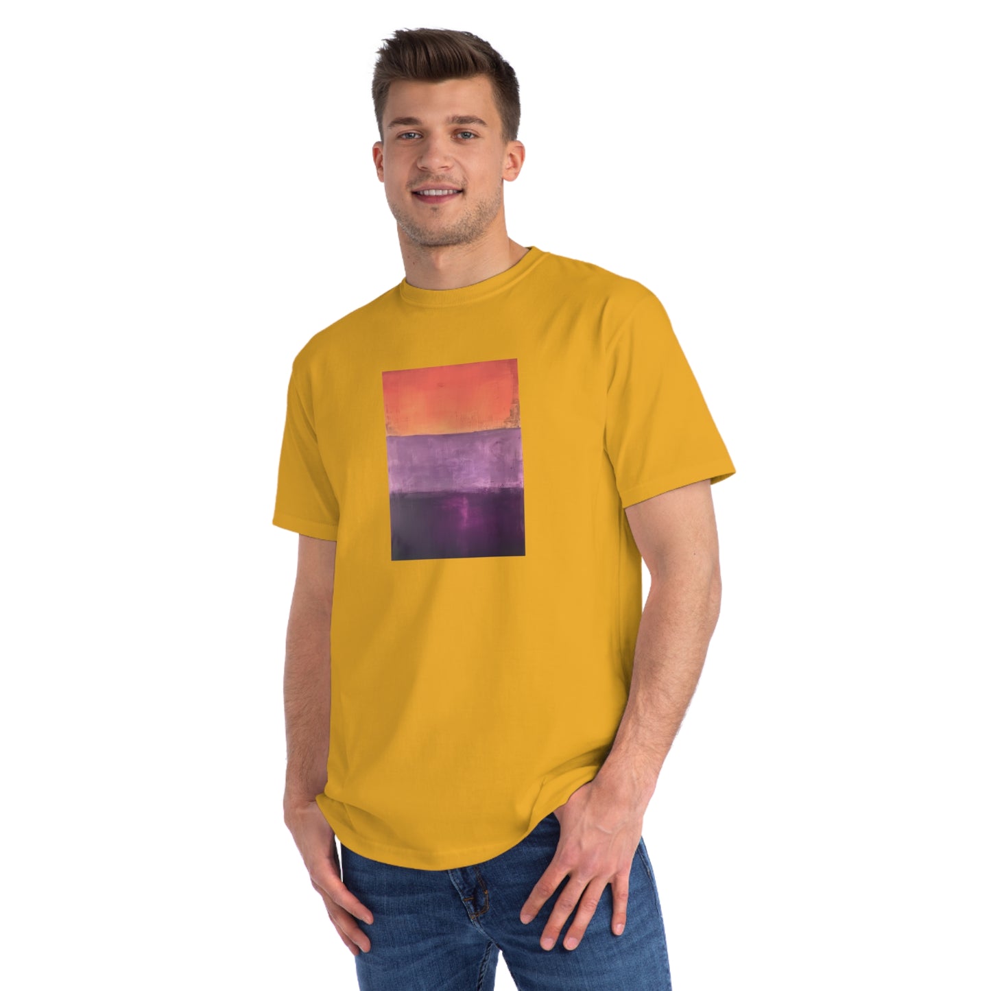 a man wearing a yellow t - shirt with a picture of a sunset