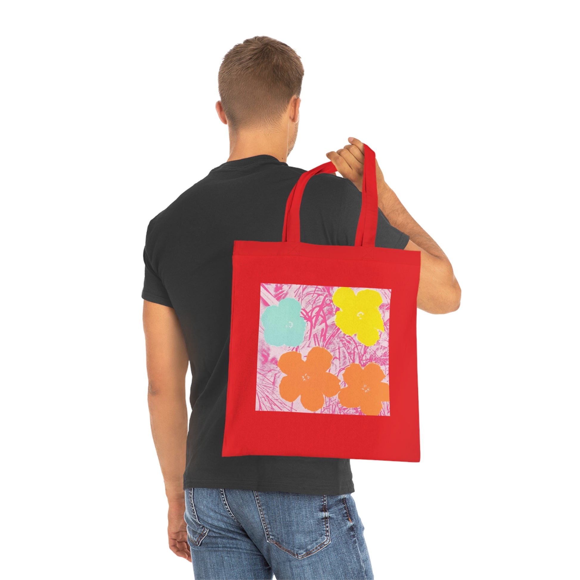 a man holding a red bag with a flower design on it