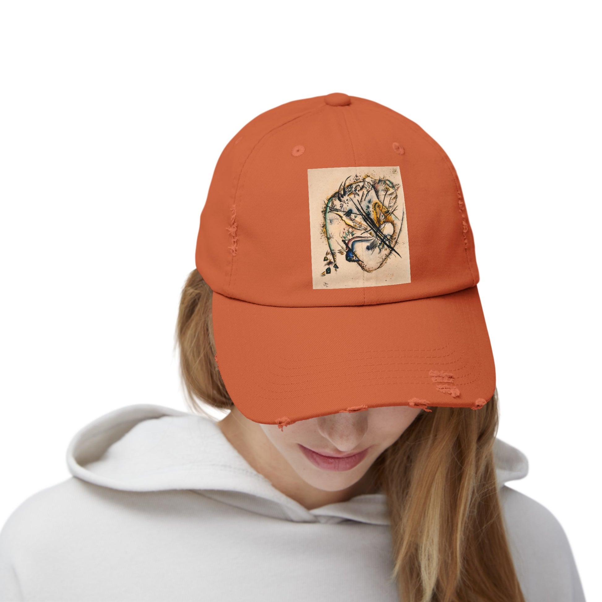 a woman wearing an orange hat with a picture of a tiger on it