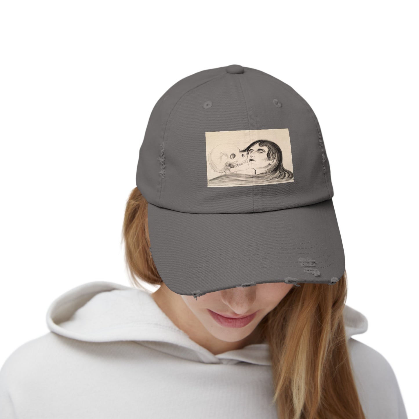 a woman wearing a gray hat with a picture of a man and woman on it