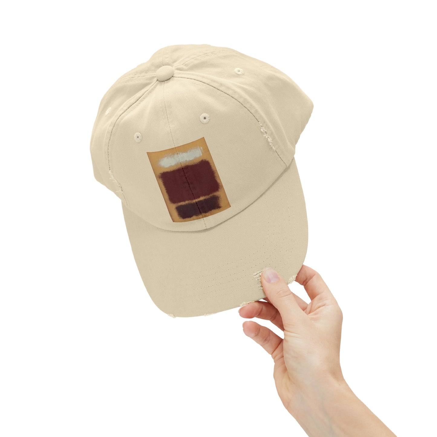 a person holding up a hat with a picture on it