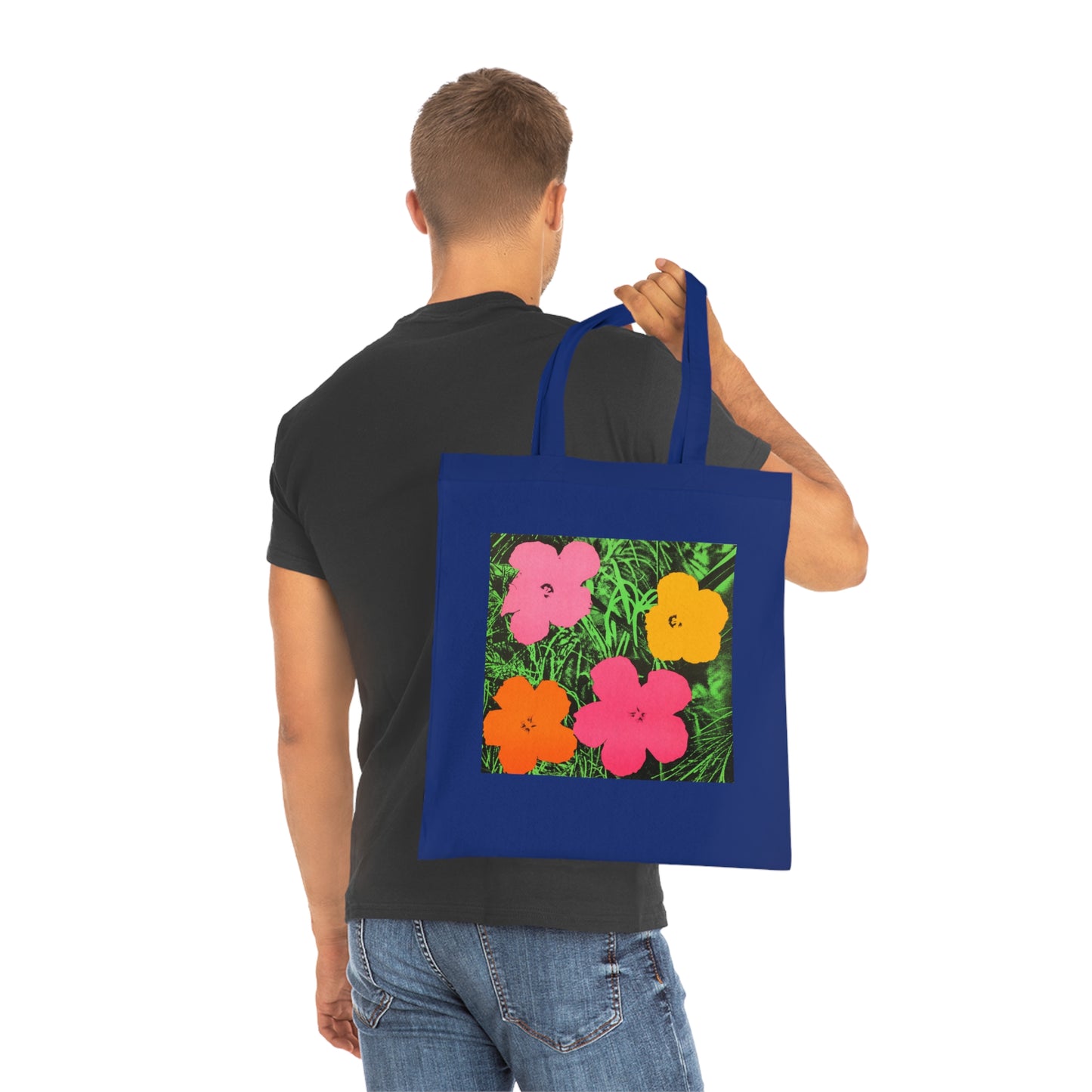 a man carrying a blue shopping bag with flowers on it