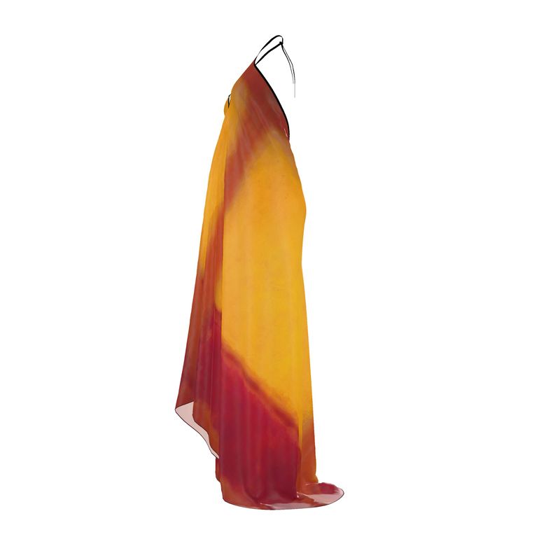 a dress hanging on a hanger on a white background