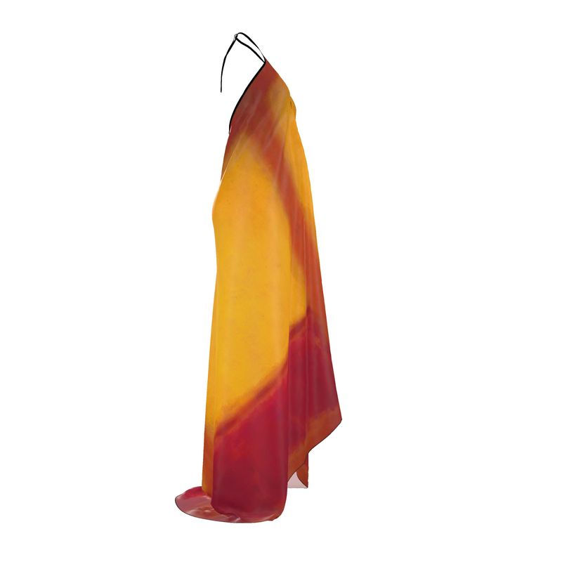 a dress hanging on a hanger on a white background