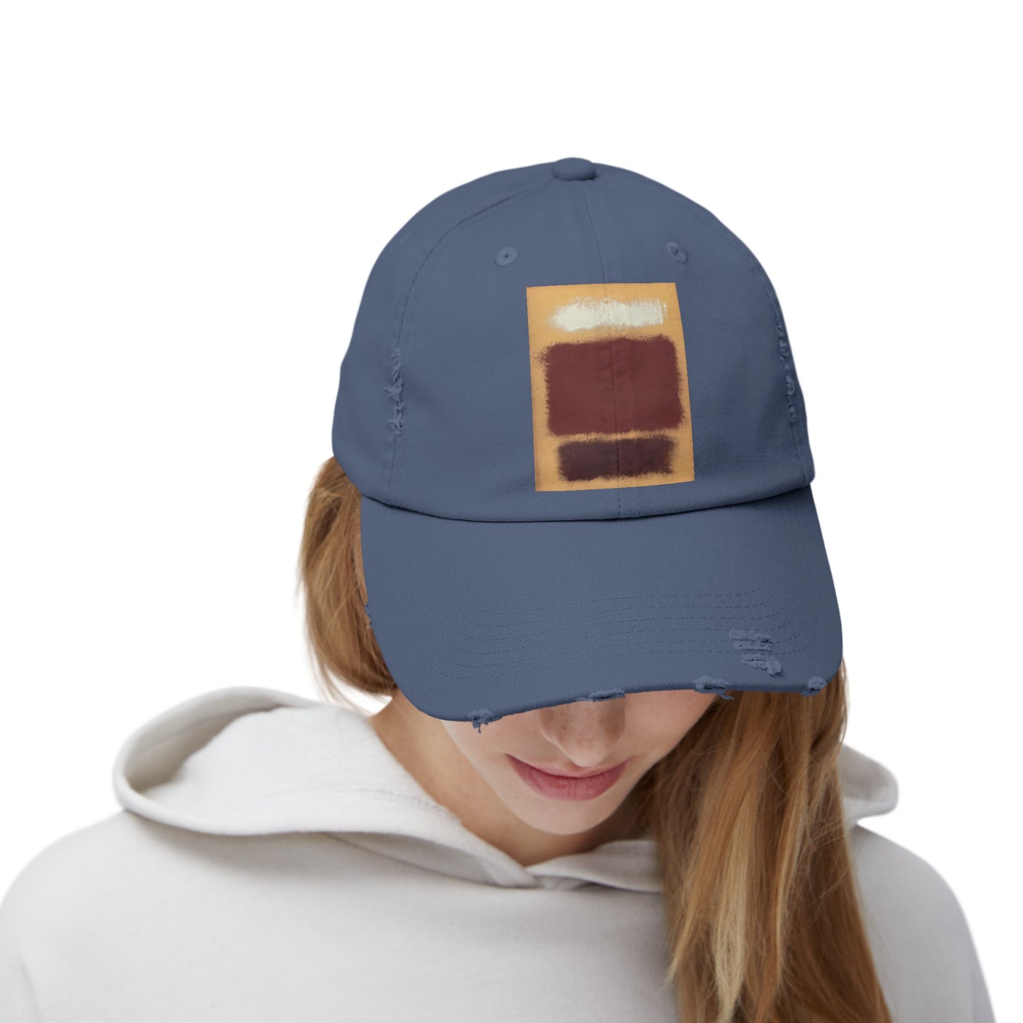 a woman wearing a blue hat with a picture of a piece of bread on it