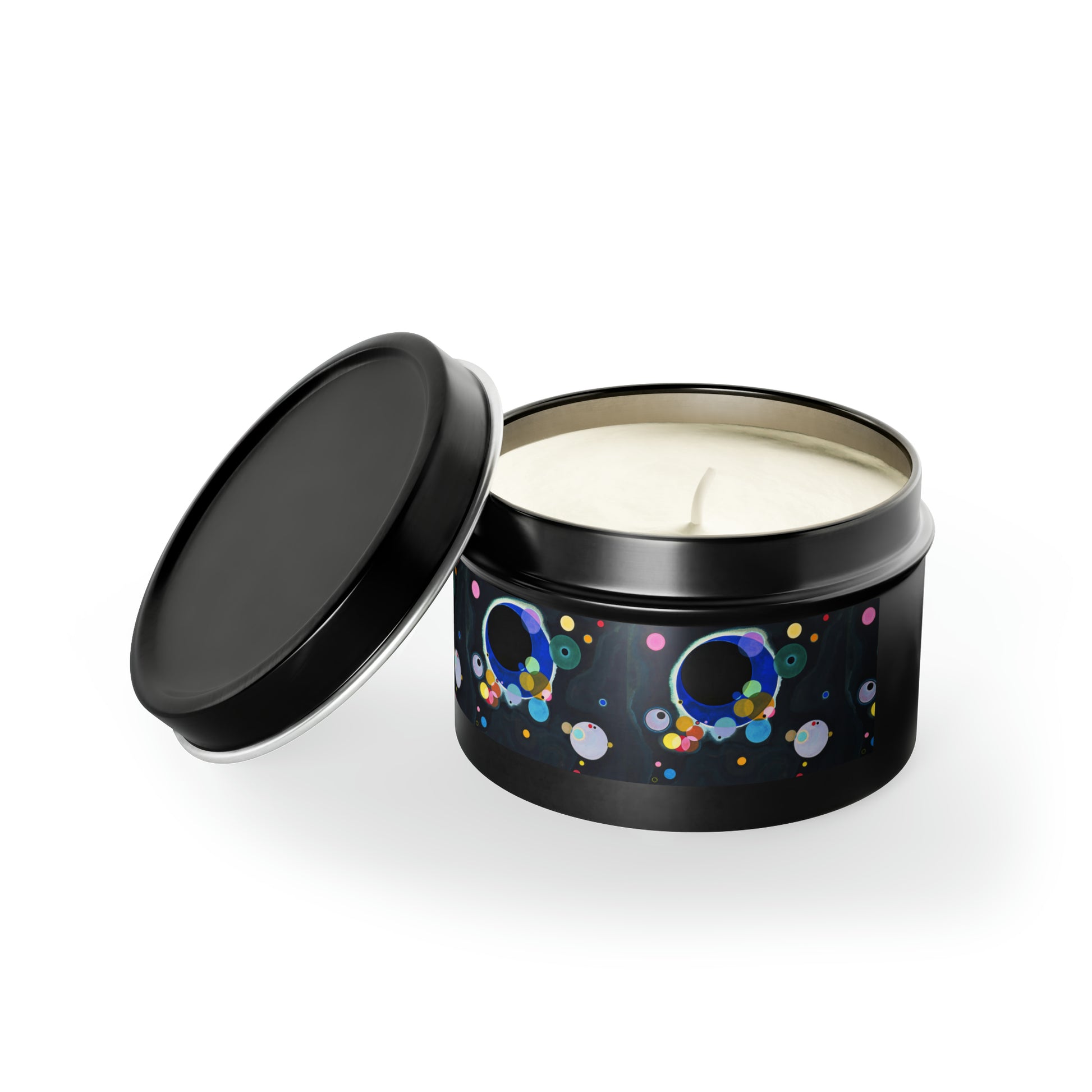a black tin with a white candle inside of it