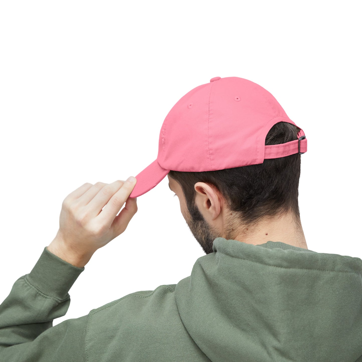 a man wearing a pink hat and a green hoodie